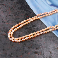 Fresh Water Pearl In Pink String